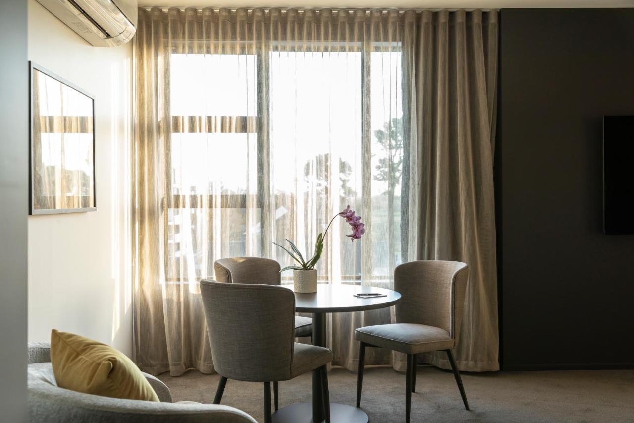 The Mayfair Christchurch Extérieur photo A living room with a curtain